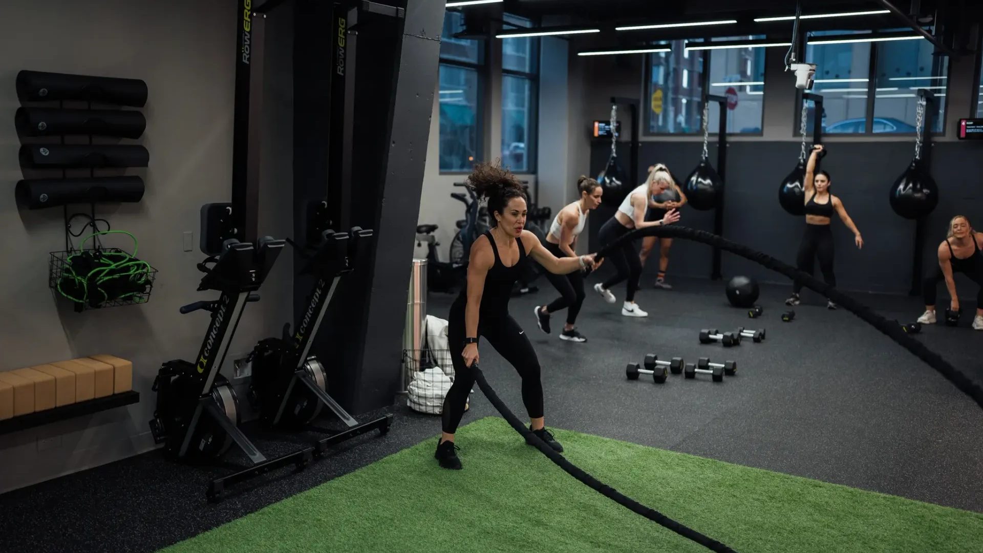 Coaches training clients on the strength floor of a FLEX facility in Washington, DC